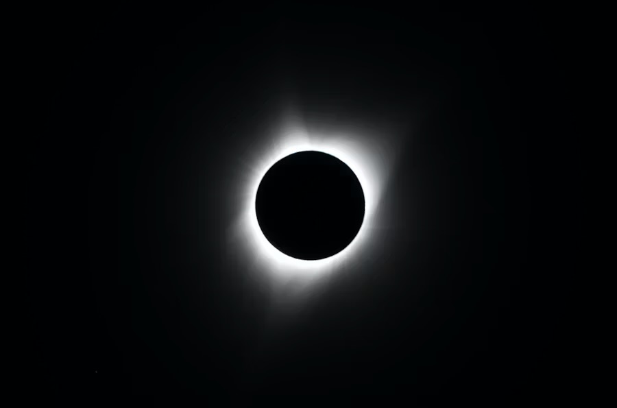 A total solar eclipse, the moon's silhouette ringed by the sun's corona