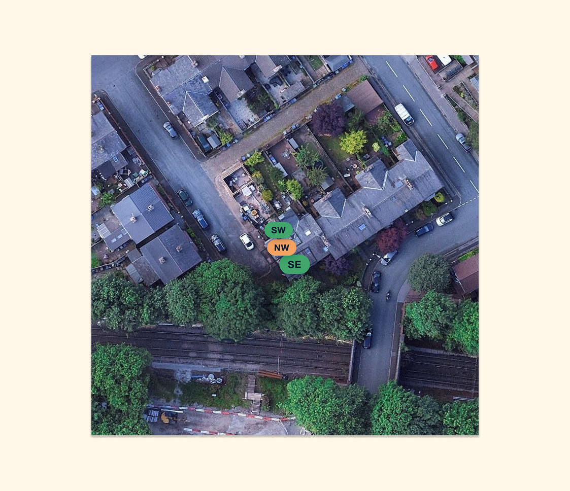 An aerial view of a UK terraced street showing rooftops from directly above